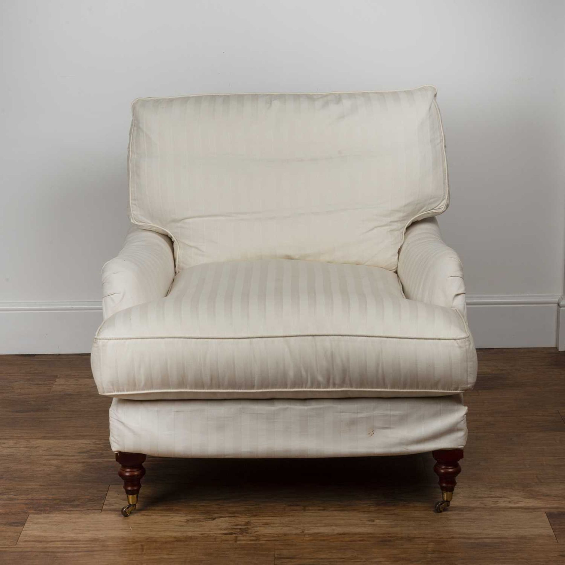 Howard style armchair Contemporary, with white striped upholstery, on brass castors, 86cm wide - Image 2 of 5
