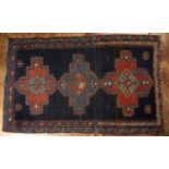 Hamadan blue ground rug with three central medallions, 191cm x 116cm, and a brick-red ground