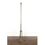 Brass standard lamp 20th Century, with repeating scrolling motifs, standing on a tripod base,