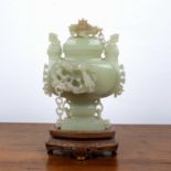 Carved jade urn and cover Chinese, set with chi-lin dragons and miniature guardian dogs, on an