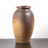 Stoneware ribbed tall vase of reeded form, 43cm highWith some marks and slight chips particularly