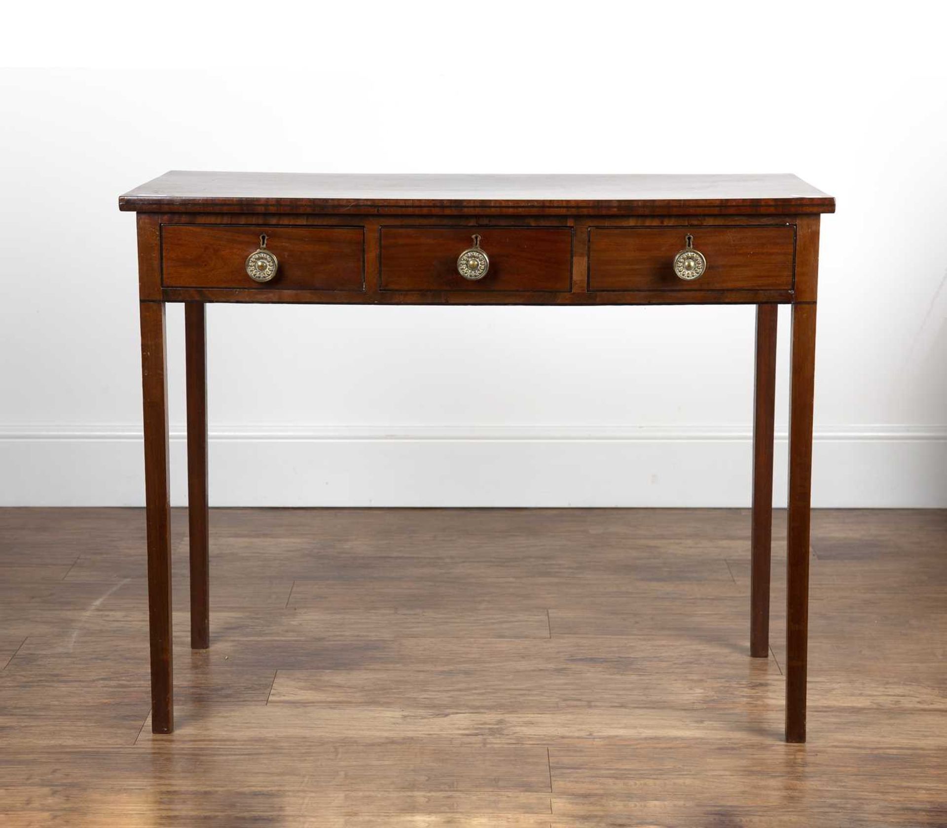 Mahogany side table 19th Century, fitted with three frieze drawers and round brass handles, standing