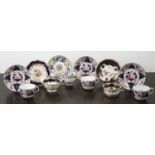 Group of porcelain cups and saucers English, circa 1830/50, including a set of three painted with
