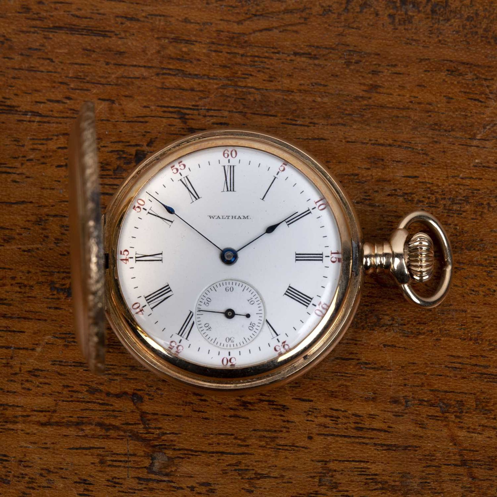 14k gold cased Waltham full hunter pocket watch the cover concealing a white enamel dial with