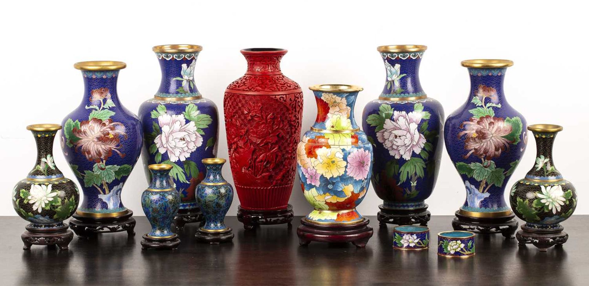 Group of cloisonne vases Chinese, 20th Century, including stands and a cinnabar lacquer vase,