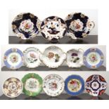 Group of botanical and other porcelain plates English, 19th Century, including three white ground