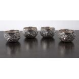 Four small silver thabiek bowls Burmese, each with embossed designs, 6cm diameter x 3.5cm highWith a