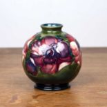 Moorcroft Pottery globular vase, on green ground, decorated with the 'anemone' pattern, impressed