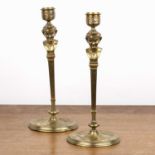 Pair of Art Nouveau brass candlesticks Possibly French, with figural faun decoration, on tapering