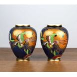 Pair of Carltonware vases with Art Deco bird decoration on blue ground, transfer marks to the