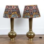 Pair of Persian brass converted lamps previously vases,with engraved foliate designs, unmarked, with