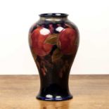 Moorcroft pottery 'Pomegranate' tall baluster vase, impressed marks and facsimile signature to the