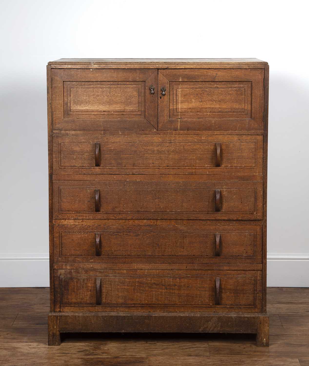 Attributed to Gordon Russell (1892-1980) oak, chest of drawers, with two doors enclosing slide