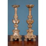 A pair of French carved and gilt pine table lamps converted from antique candlesticks