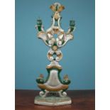 An antique Italian green, silver and gold painted carved wood candelabrum