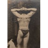 An early 20th century photograph of a male bodybuilder