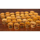 A collection of thirty five 19th century and later turned Mauchline ware napkin rings