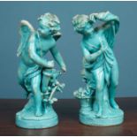 A pair of Continental turquoise glazed pottery figures of Cupid and Psyche