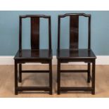 A pair of 18th or 19th century Chinese zitan and rosewood yoke back chairs