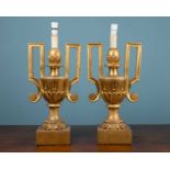 A pair of gilt wood table lamps
