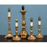 A pair of Italian carved giltwood baroque style table lamps; together with three further various gil