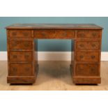 A walnut and burr walnut veneered pedestal desk