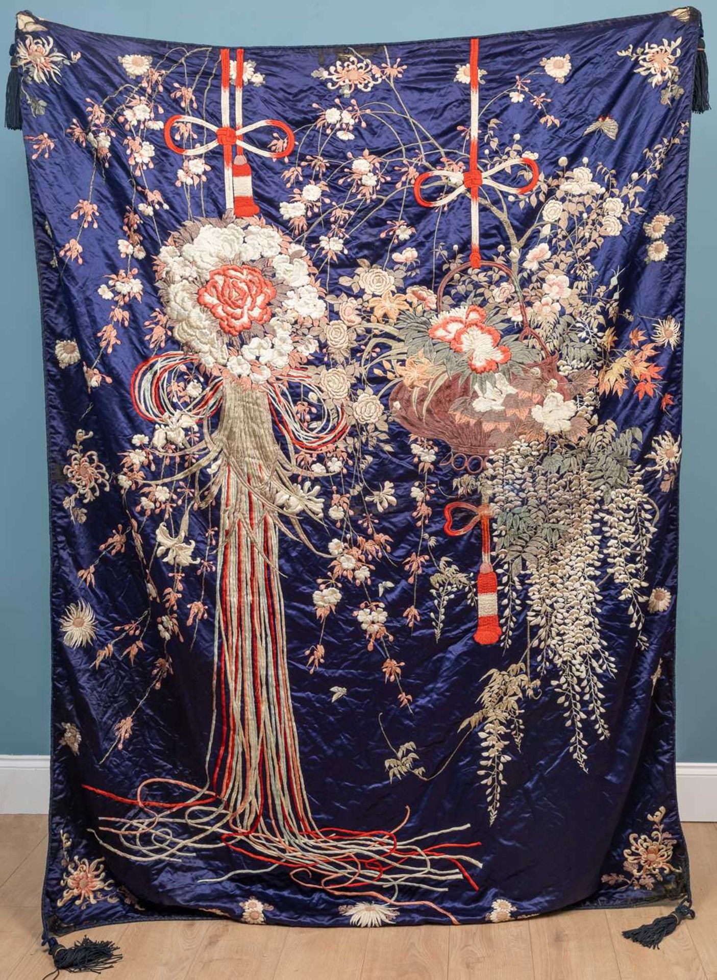 A decorative Japanese dark blue ground silk panel or hanging