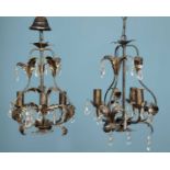 A pair of French bronzed "Marie Thérèse" three-light chandeliers