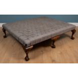 A large Country House button upholstered stool