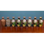 A cased set of eight vases to demonstrate the process of cloisonné manufacture