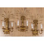 A set of three contemporary gilt carved wooden toleware wall lights