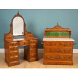 A Victorian burr elm bow fronted dressing table together with a matching marble-topped chest