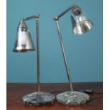A pair of adjustable table lamps