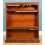 A late 19th-century oak floor standing open bookcase