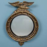 A Regency style gilt convex wall mirror