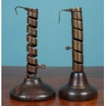 Two similar Continental spiralling pigtail type candlesticks