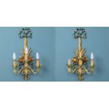 A pair of modern painted carved wooden toleware three-branch wall lights