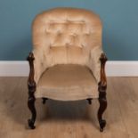 A 19th century mahogany button-back armchair