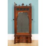 A 19th century oak gothic style swing dressing table mirror