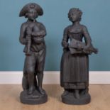 A pair of painted plaster figures of a boy and a girl in the manner of John Cheere