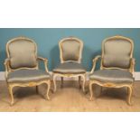 A pair of 18th century French armchairs together with a matching side chair