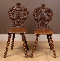 A pair of 19th century Swiss hall chairs