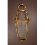 A brass and glass-panelled octagonal hall lantern