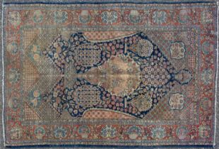 A machine woven Kashan style rug