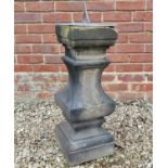 A Victorian carved stone stepped baluster surmounted by a lead sundial
