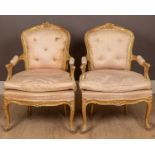 A pair of antique 18th century style carved gilt wood and gesso moulded salon chairs