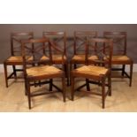 A set of six Regency oak cross-back dining chairs