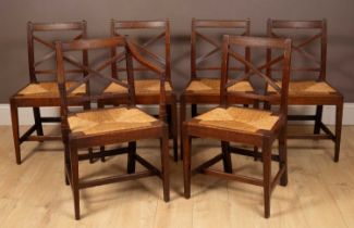 A set of six Regency oak cross-back dining chairs