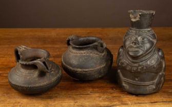 Three possibly South American pottery vessels, one figural