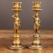 A pair of gilt brass candlesticks